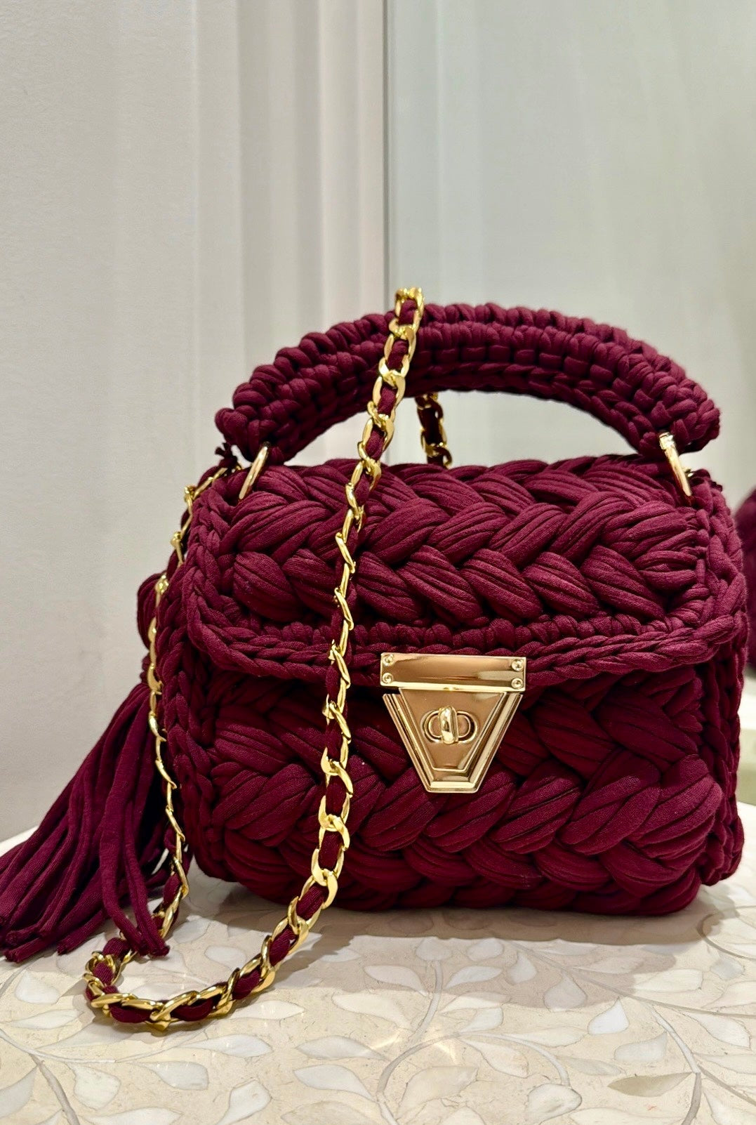 The cove crochet clutch, wine