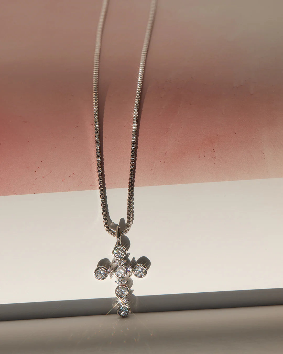 The rosette cross charm, silver